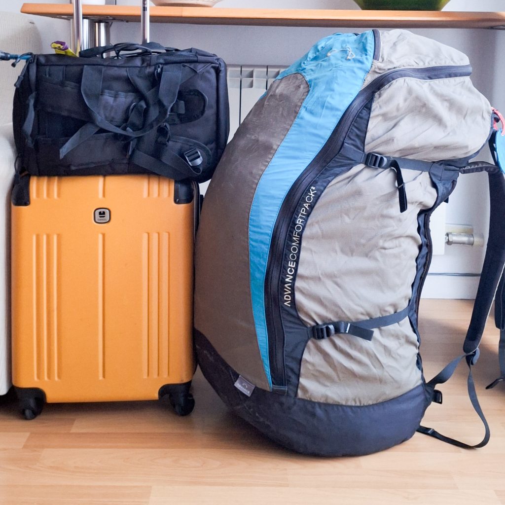 Paragliding travel gear prepared for a winter flight trip from Spain to Morocco